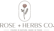 Logo for Rose + Herbs Co. featuring a rose and leaves design on a white background.